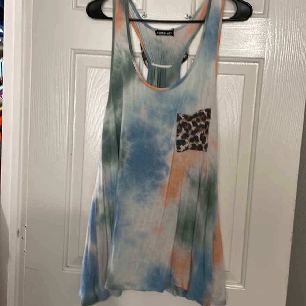 Tie dye tank top with cheetah pocket on front and cheetah bow on back. Size med